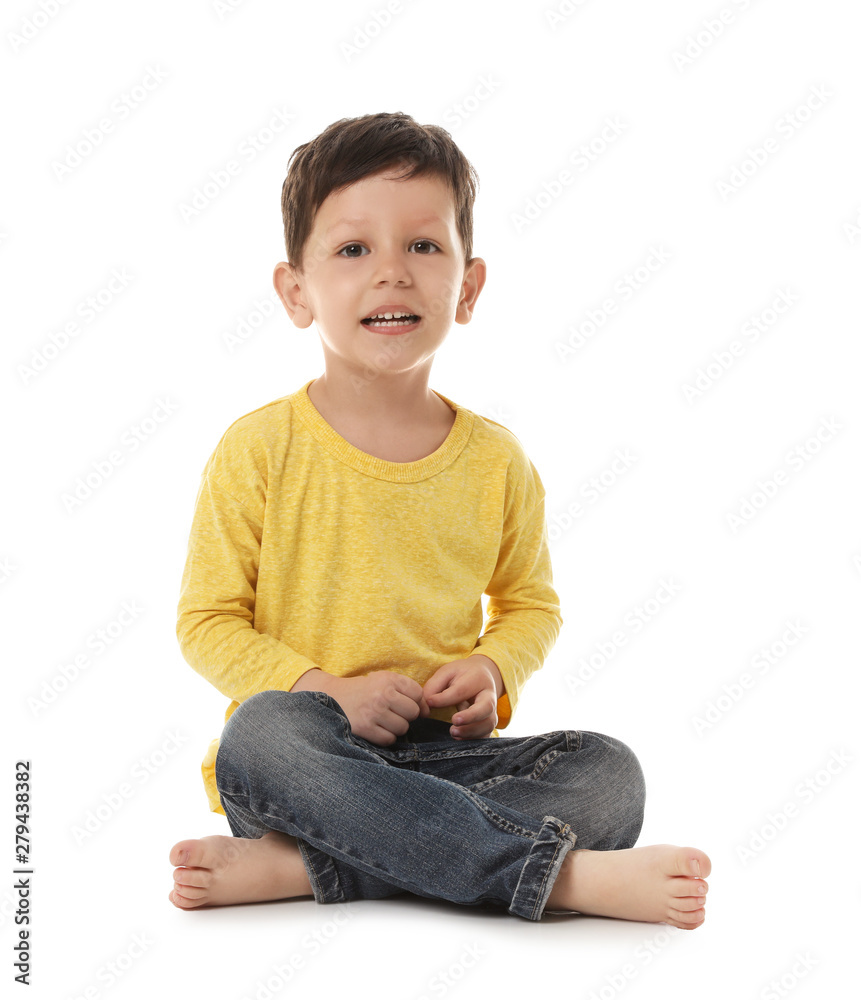 Portrait of cute little boy sitting on white background Portrait of cute little boy sitting on white background