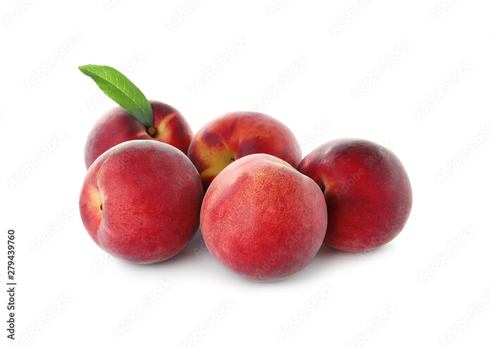 Delicious ripe peaches with leaf isolated on white Delicious ripe peaches with leaf isolated on white