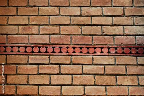 The texture of the old brick wall with a mosaic of the 19th century