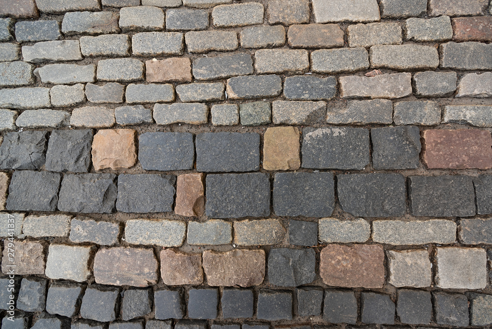 Texture of old colorful square paving stones