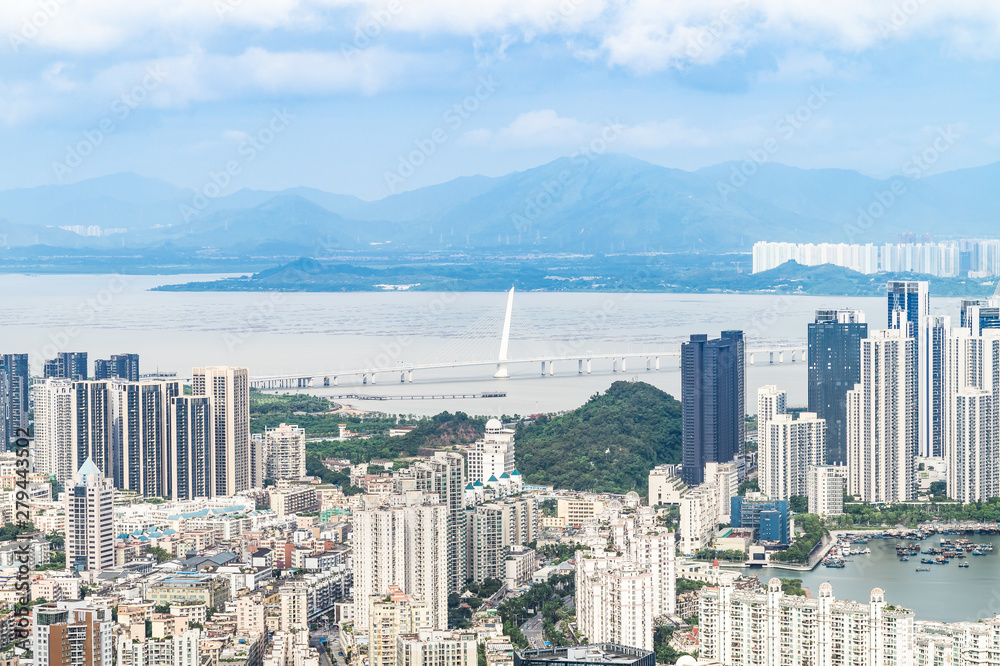 Fototapeta premium Shenzhen Nanshan District, Shenzhen, China residential real estate and Shenzhen Bay Bridge