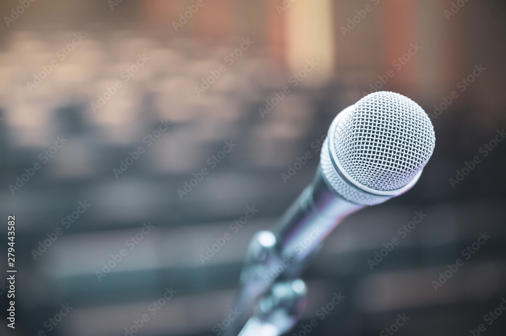 Microphone over the blurred business forum Meeting or Conference Room Concept, Blurred background.