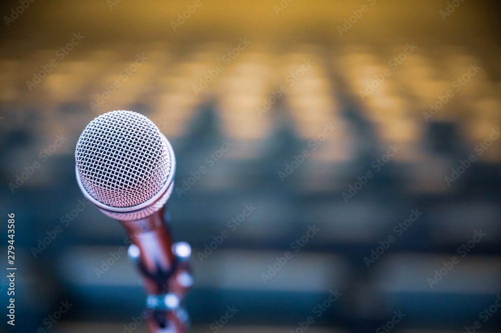 Microphone over the blurred business forum Meeting or Conference Room Concept, Blurred background.