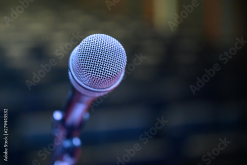 Microphone over the blurred business forum Meeting or Conference Room Concept, Blurred background.