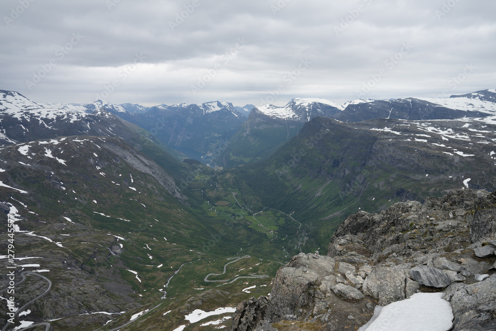 Panoramic view at Geiranger village and fjord from Dalsnibba which offers a Europe's highest fjord view from a road and is therefore a popular tourist destination. Scandinavia, Europe.