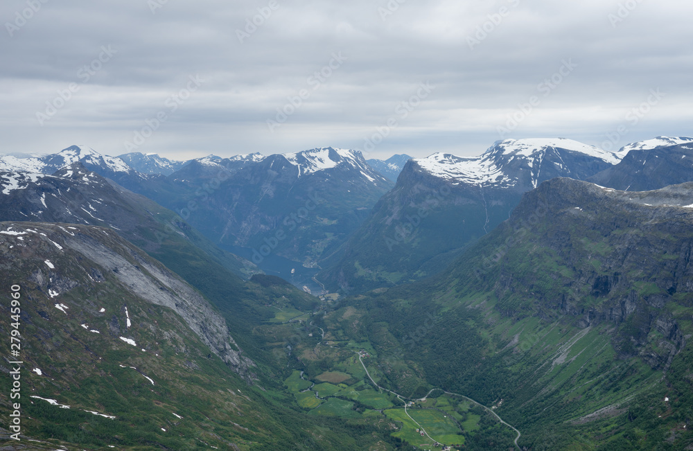 Panoramic view at Geiranger village and fjord from Dalsnibba which offers a Europe's highest fjord view from a road and is therefore a popular tourist destination. Scandinavia, Europe.