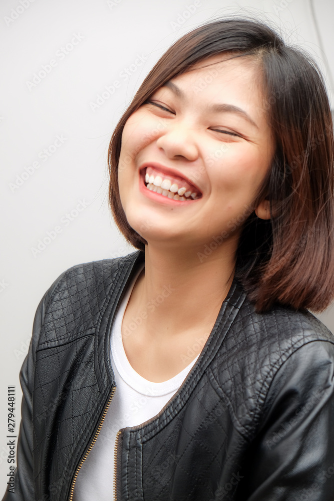 Attractive smiling women wear black leather shirt Attractive smiling women wear black leather shirt