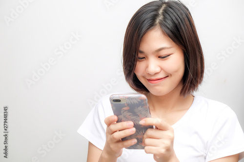 Beautiful women typing text smartphone on white background