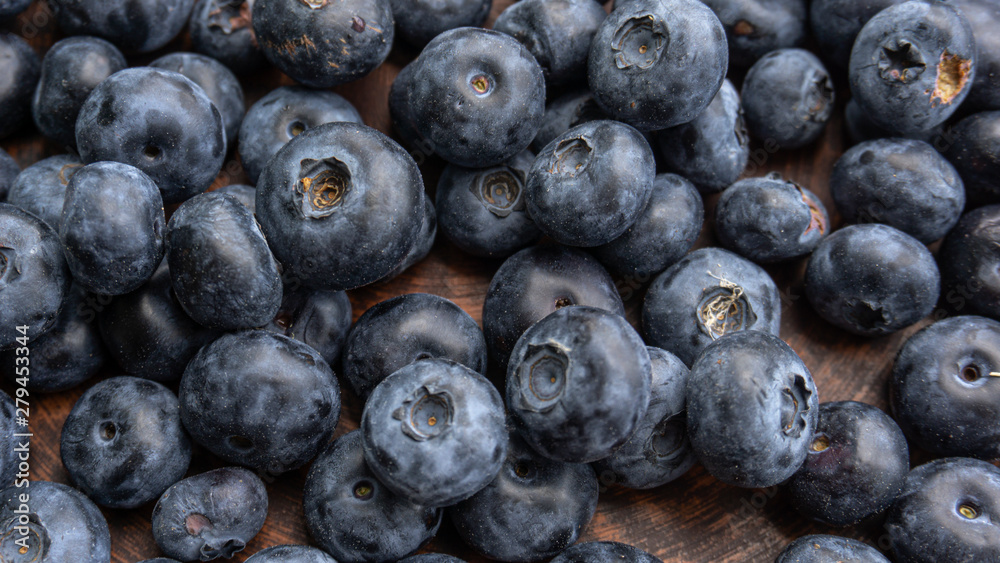 Blueberries and blueberries on the background of pottery. Black berries. Blueberries and blueberries on the background of pottery. Black berries.