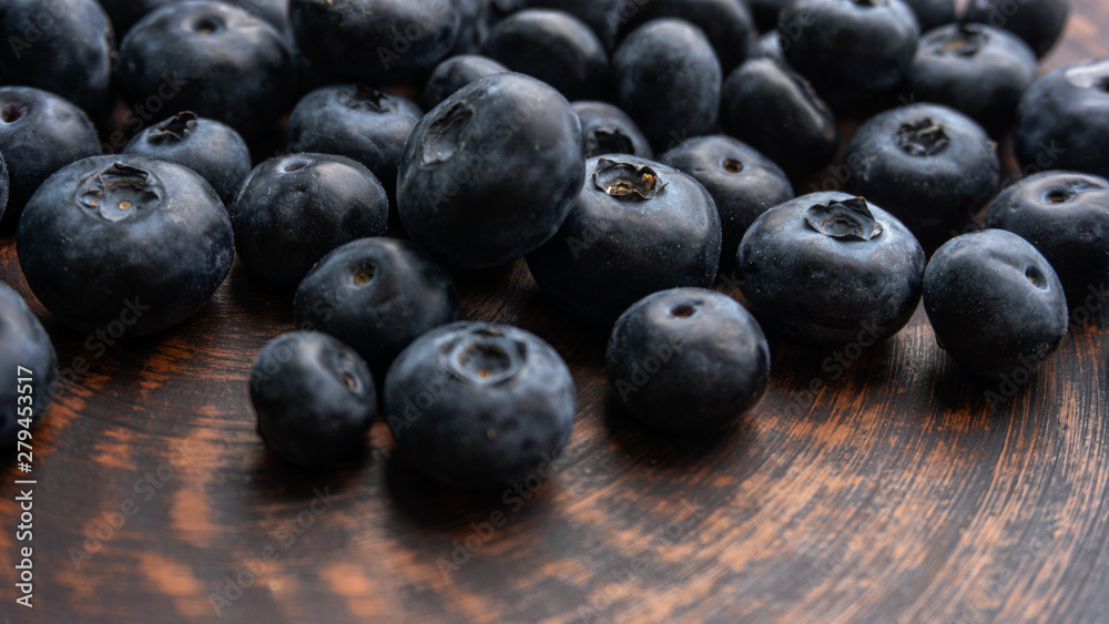 Blueberries and blueberries on the background of pottery. Black berries. Blueberries and blueberries on the background of pottery. Black berries.