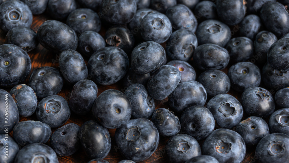 Blueberries and blueberries on the background of pottery. Black berries. Blueberries and blueberries on the background of pottery. Black berries.