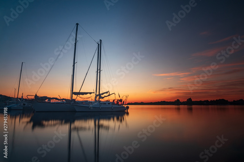 Vacation holiday fishing journey sunrise Sail boat Yacht at quay. Nautical, relaxation. © welcomeinside