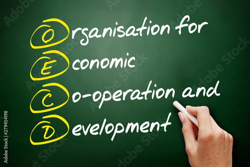 OECD - Organisation for Economic Co-operation and Development acronym, business concept on blackboard