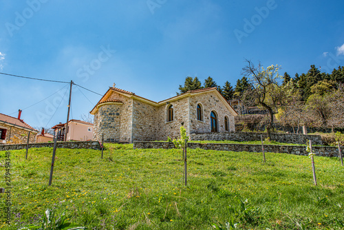 Church made of stone in Baltessiniko village, Greece. photo