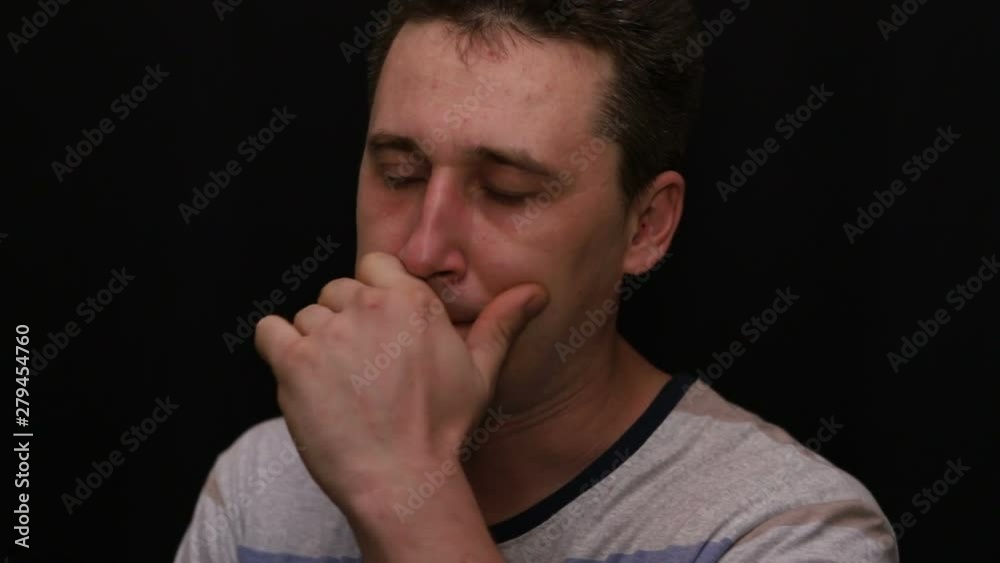 sad young handsome caucasian man shows his emotion close-up sad young handsome caucasian man shows his emotion close-up