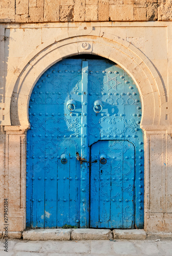 Arched Doorway with Blue Studded Door, Africa, North Africa, Tunisia, Sidi Bou Said © alekosa
