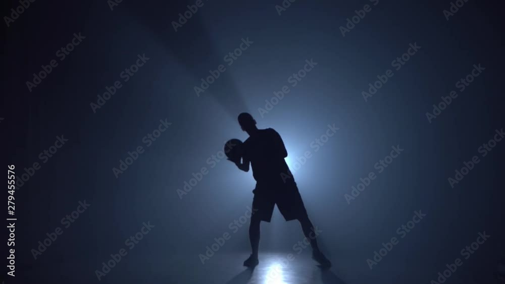 Guy showing tricks with ball while holding it on head. Guy showing tricks with ball while holding it on head.