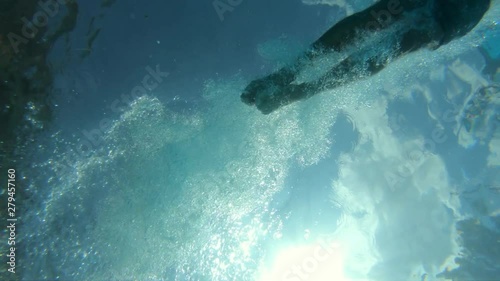 Plunging in water from below, shot in les Marécottes swimming pool. Slow motion, shot at 100 fps.