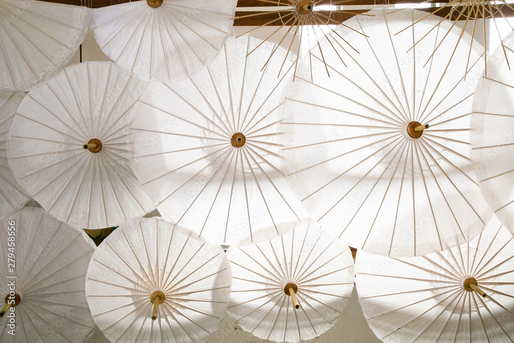 The beautiful white umbrella made of bamboo and fabric.