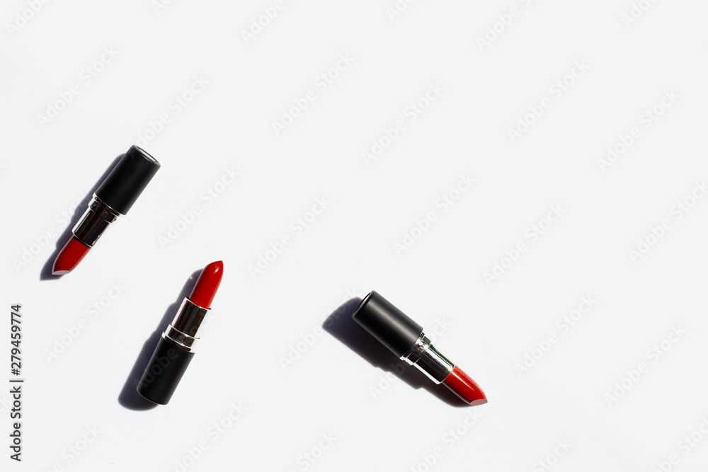 Obraz premium Flat lay composition, Lipsticks on white background with shadow. Beautiful Make-up concept
