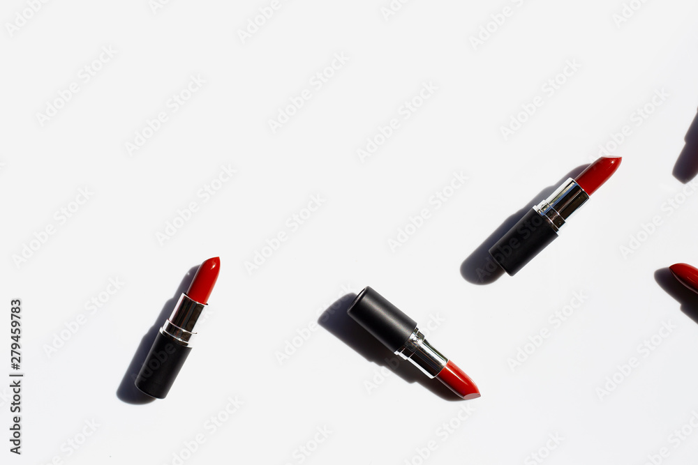 Flat lay composition, Lipsticks on white background with shadow. Beautiful Make-up concept Flat lay composition, Lipsticks on white background with shadow. Beautiful Make-up concept
