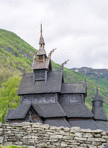 iking era wonder, Borgund Stave Church (Norwegian: stavkyrkje), situated at The King's Road across Filefjell. Built between 1180 and 1250 AD. Cloudy midsummer evening photo