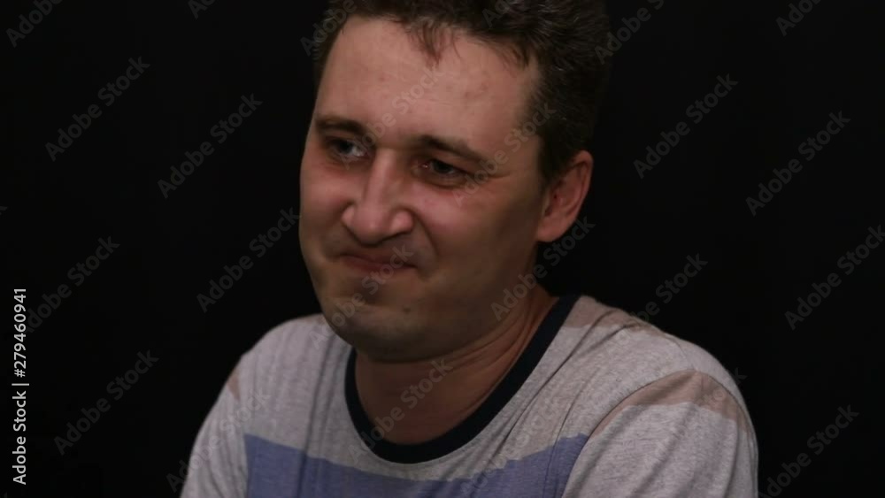 angry young handsome caucasian man shows his emotion close-up angry young handsome caucasian man shows his emotion close-up