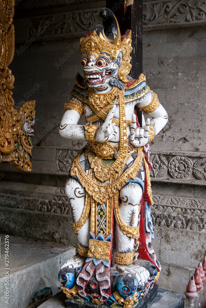 Balinese sculpture white and gold.