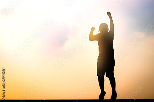 Obraz na plátně The boy jumped, raised his hand, happy to reach the goal