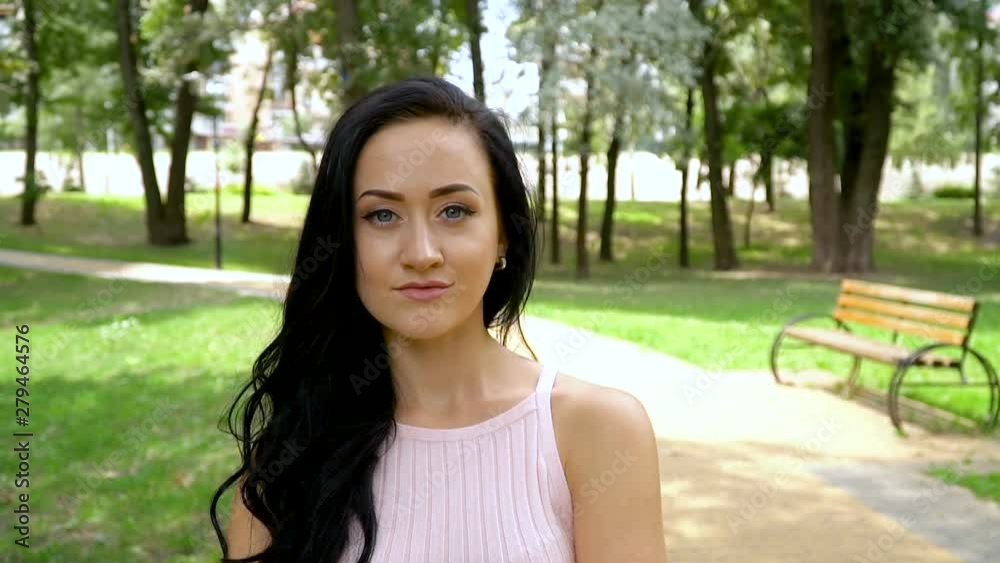 Portrait of a girl in a summer park