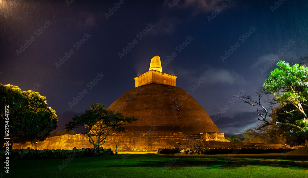 Stupa Jetavanaramaya in beams of night illumination.