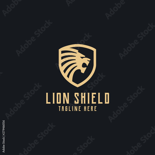 Gold lion head with shield logo vector design template in isolated black background photo