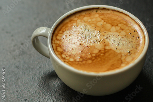 coffee freshly brewed in a white cup serving of beverage (coffee grain). food. top. copy space