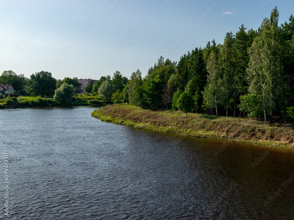 Picture of a beautiful lake and clouds, summer sunny day with reflections, Latvia