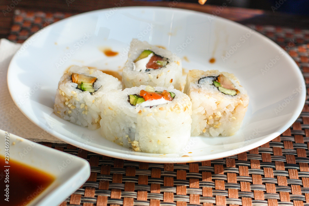 Sushi maki rolls (tuna, salmon, shrimp, avocado and other ingredients). japanese food. Top view, assorted sushi, menu. copy space Sushi maki rolls (tuna, salmon, shrimp, avocado and other ingredients). japanese food. Top view, assorted sushi, menu. copy space