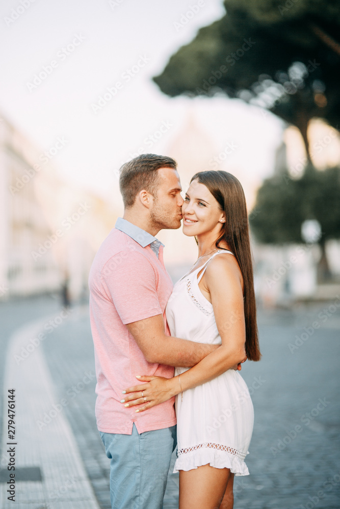 Happy couple at dawn strolling in Italy. Morning summer photo shoot in Rome. Happy couple at dawn strolling in Italy. Morning summer photo shoot in Rome.