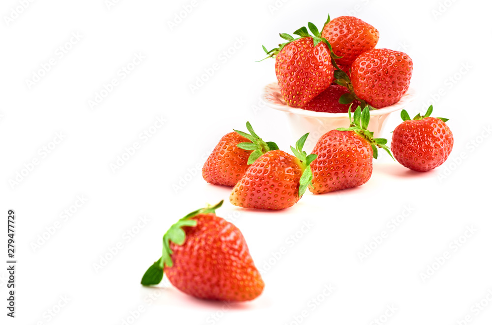 Strawberry berries on a saucer isolated on a white background. Strawberry berries on a saucer isolated on a white background.