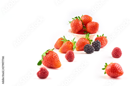 Composition of strawberries, blackberries, blueberries, raspberries and red currants on a white background.