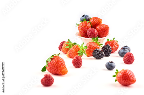 Composition of strawberries  blackberries  blueberries  raspberries and red currants on a white background.