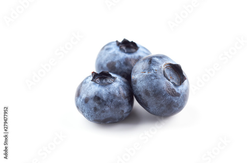 Three blueberry berries isolated on white background.