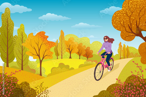 Healthy Lifestyle Concept. Active Woman Excercising in Park. Girl Riding Bicycle. Outdoor Activities. Autumn  Landscape with Trees and Leaves.