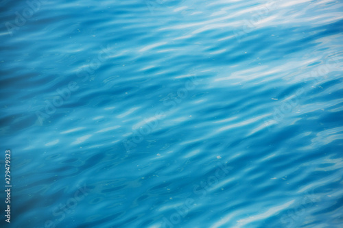 The surface of the sea water with ripples and light deep blue color