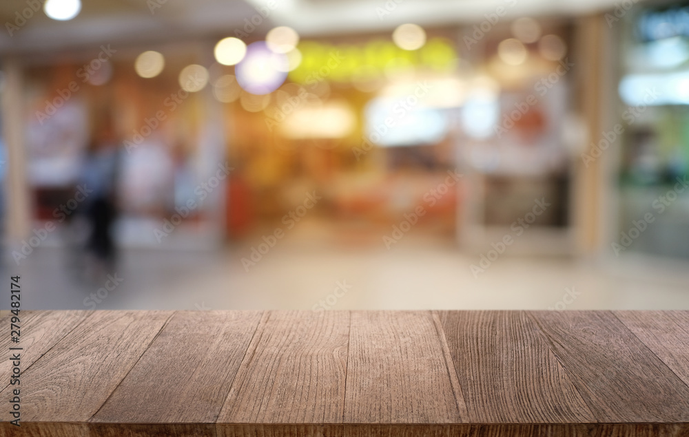 Empty dark wooden table in front of abstract blurred bokeh background of restaurant . can be used for display or montage your products.Mock up for space. Empty dark wooden table in front of abstract blurred bokeh background of restaurant . can be used for display or montage your products.Mock up for space.