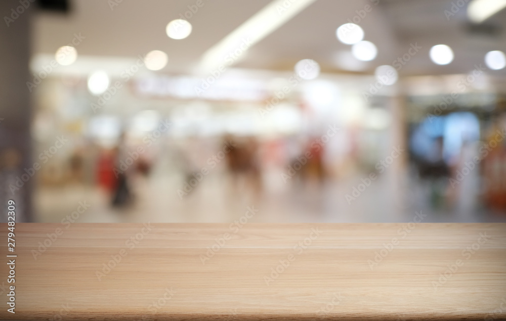 Empty dark wooden table in front of abstract blurred bokeh background of restaurant . can be used for display or montage your products.Mock up for space.