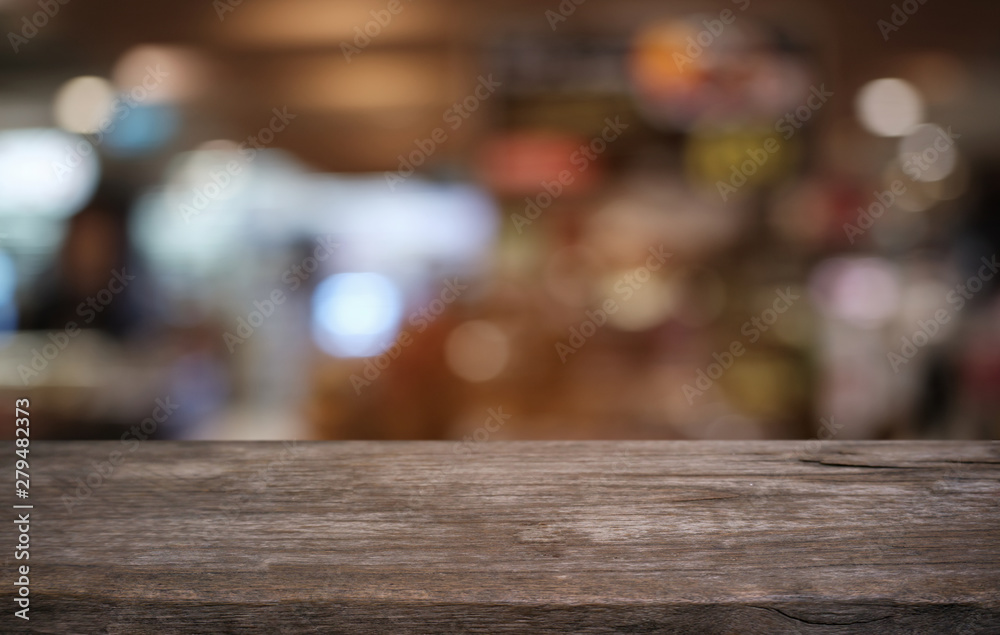 Empty dark wooden table in front of abstract blurred bokeh background of restaurant . can be used for display or montage your products.Mock up for space. Empty dark wooden table in front of abstract blurred bokeh background of restaurant . can be used for display or montage your products.Mock up for space.