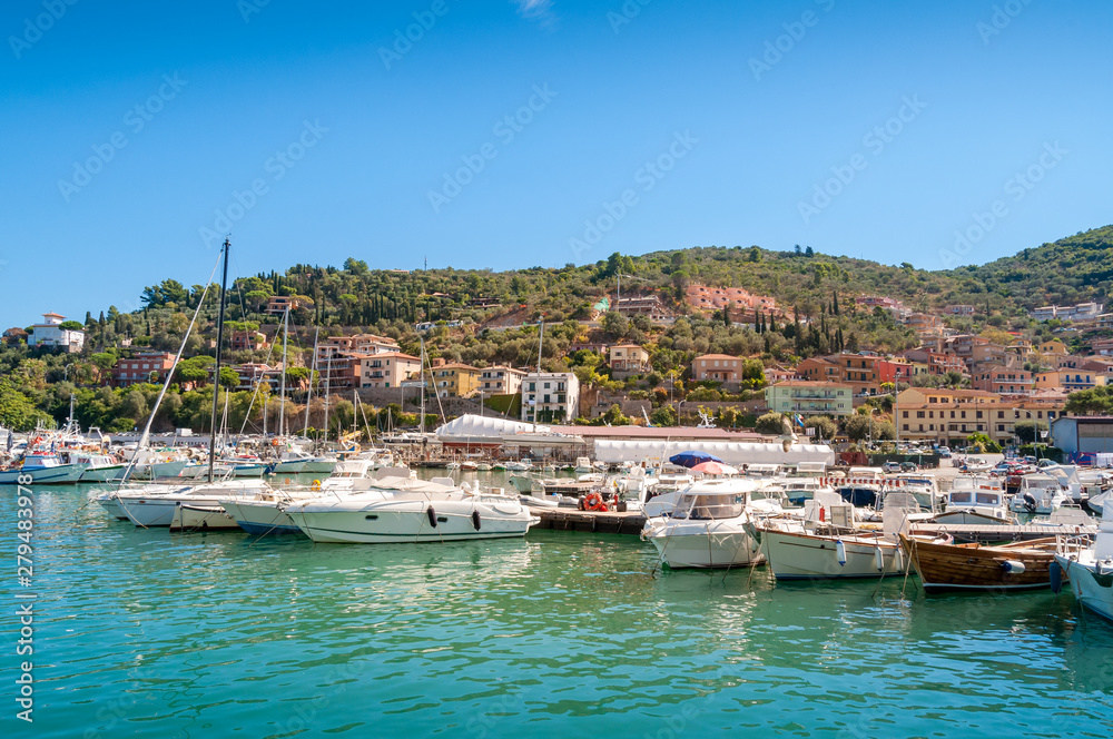 Beautiful Italian town view with yachts moored at the bay