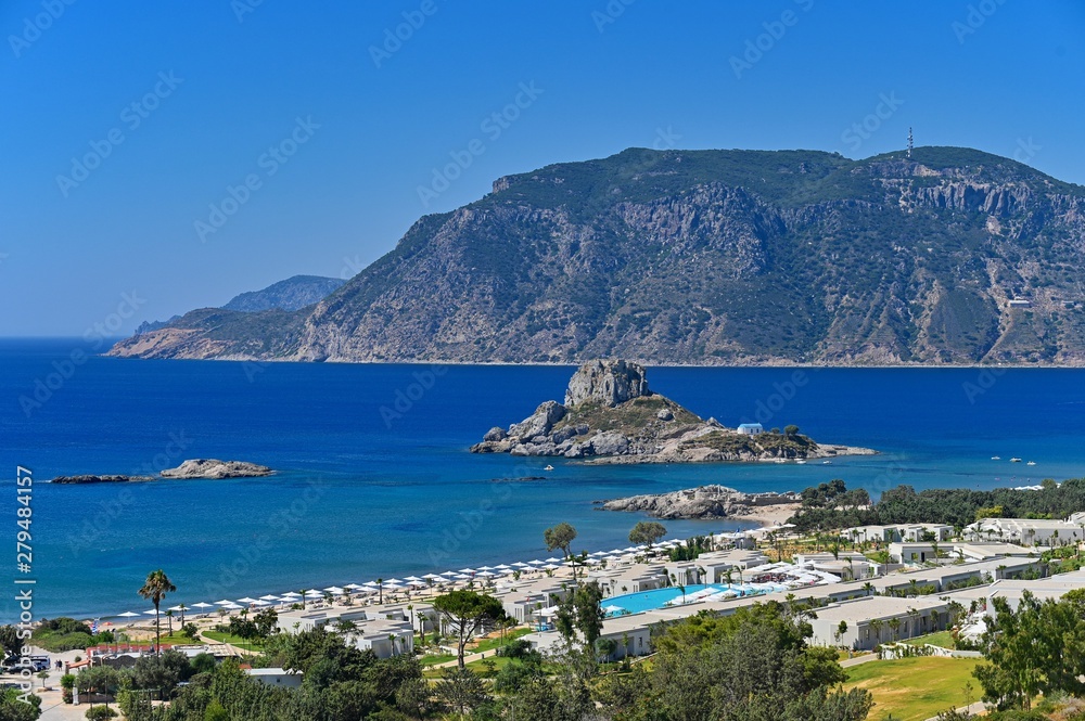 Beautiful beach with sea in tourist resort. Greece island Kos. Beautiful concept for summer vacation. Natural colorful background.