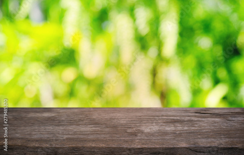 Empty dark wooden table in front of abstract blurred bokeh background of restaurant . can be used for display or montage your products.Mock up for space.