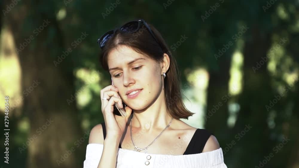 Close up of a beautiful young blonde woman talking on mobile phone Close up of a beautiful young blonde woman talking on mobile phone
