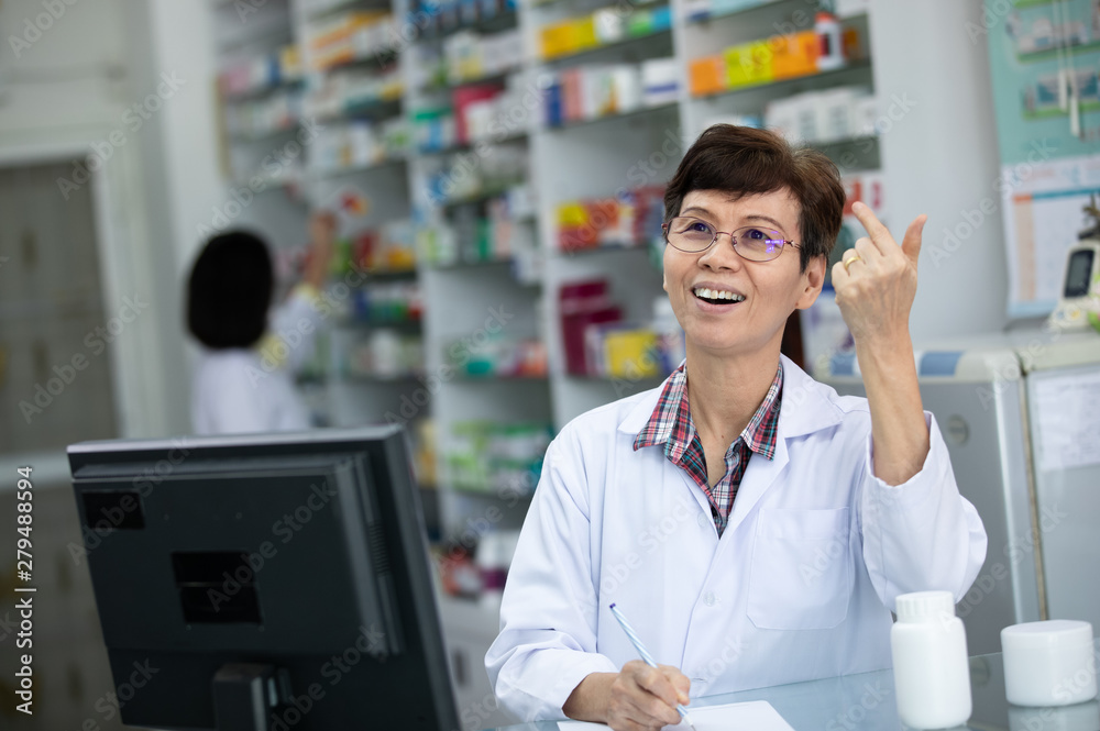 asian elderly pharmacist she was very happy even though she was thinking about something asian elderly pharmacist she was very happy even though she was thinking about something